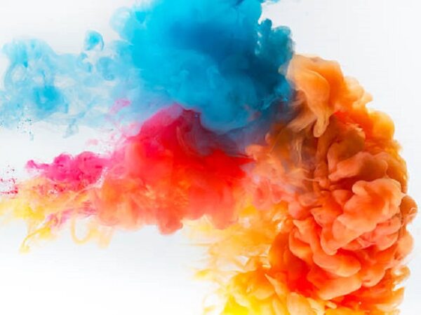 Red, yellow and blue colors paint splash on a white background.